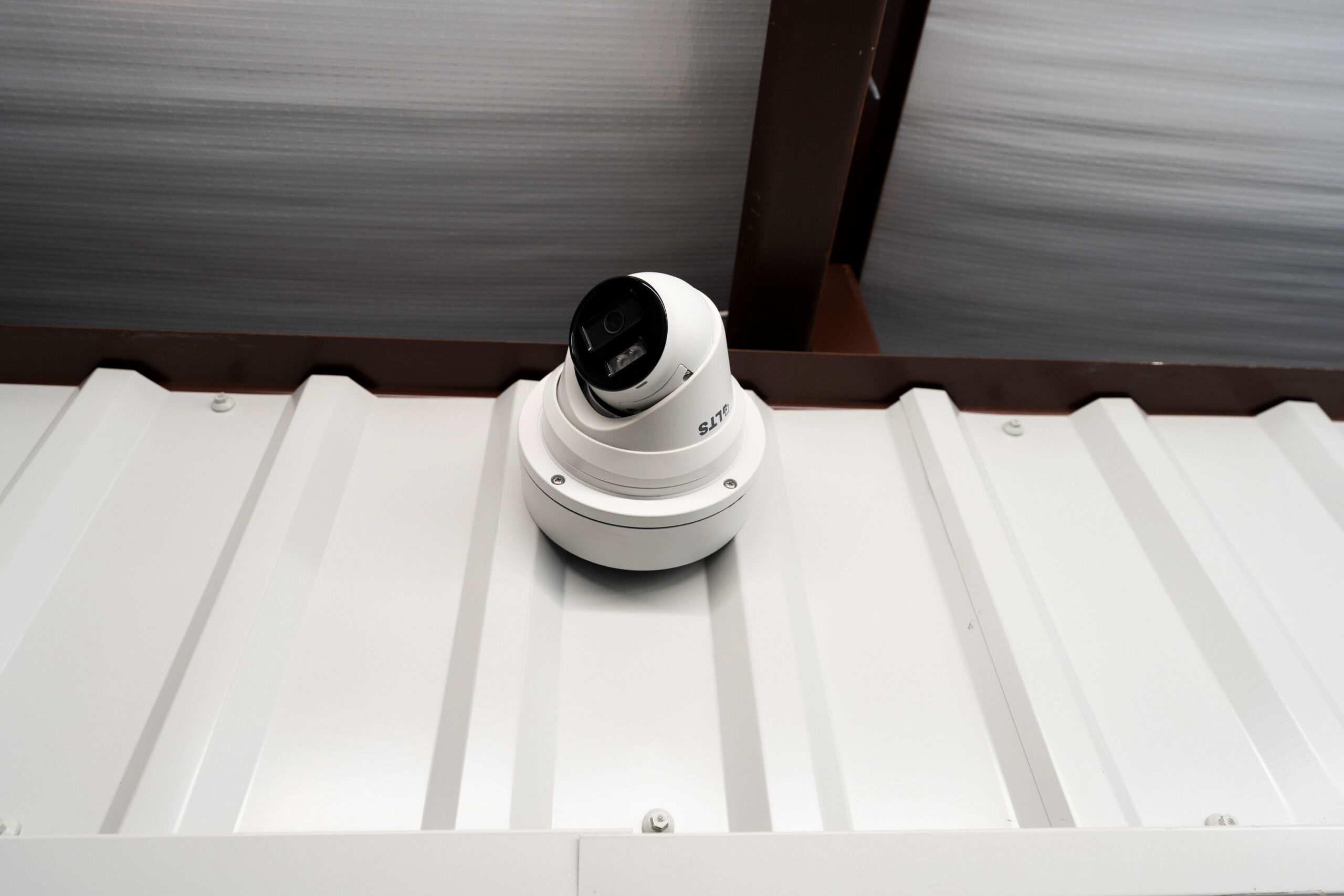 Security camera mounted on a storage building