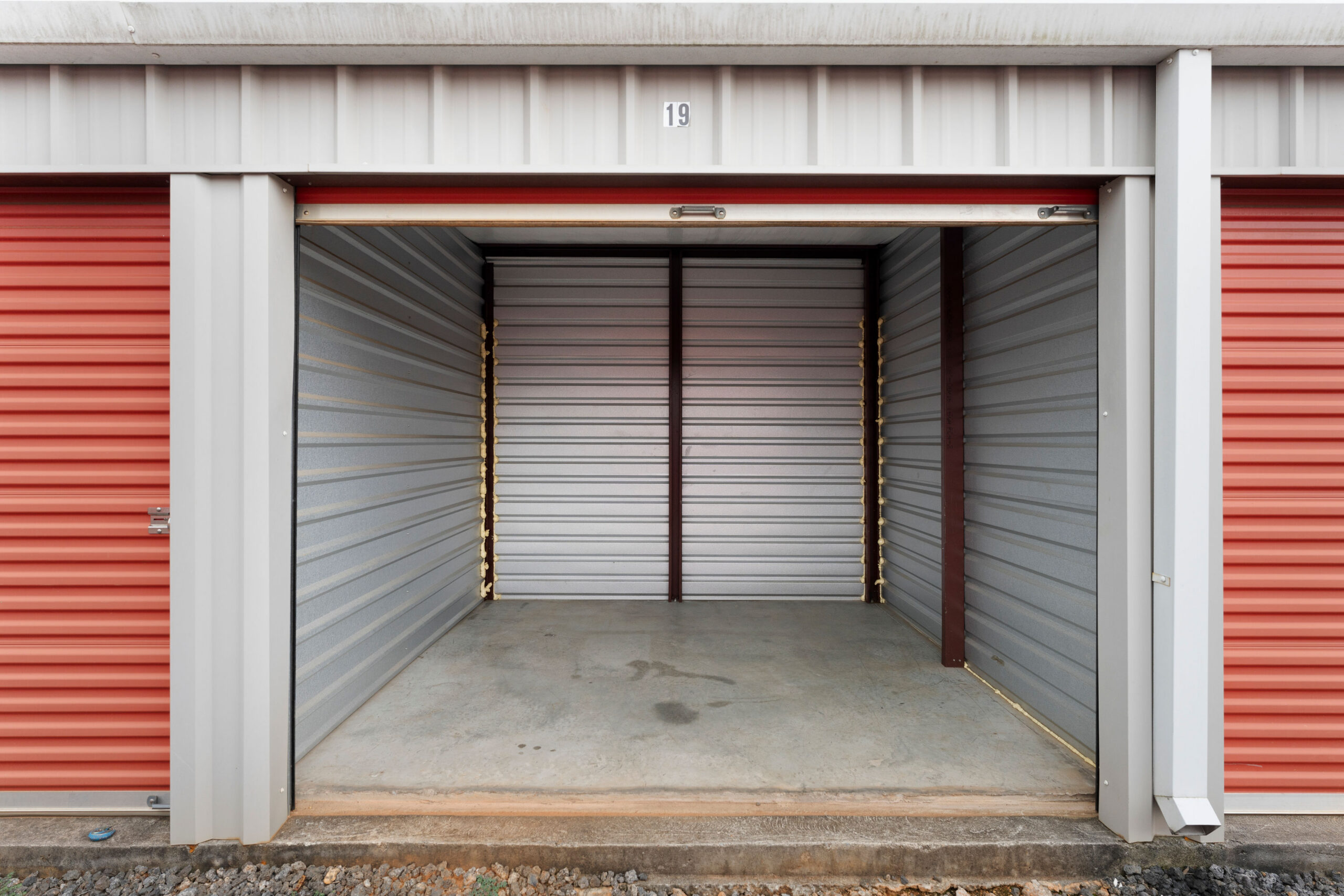 Open drive-up storage unit number 19 between red roll-up doors